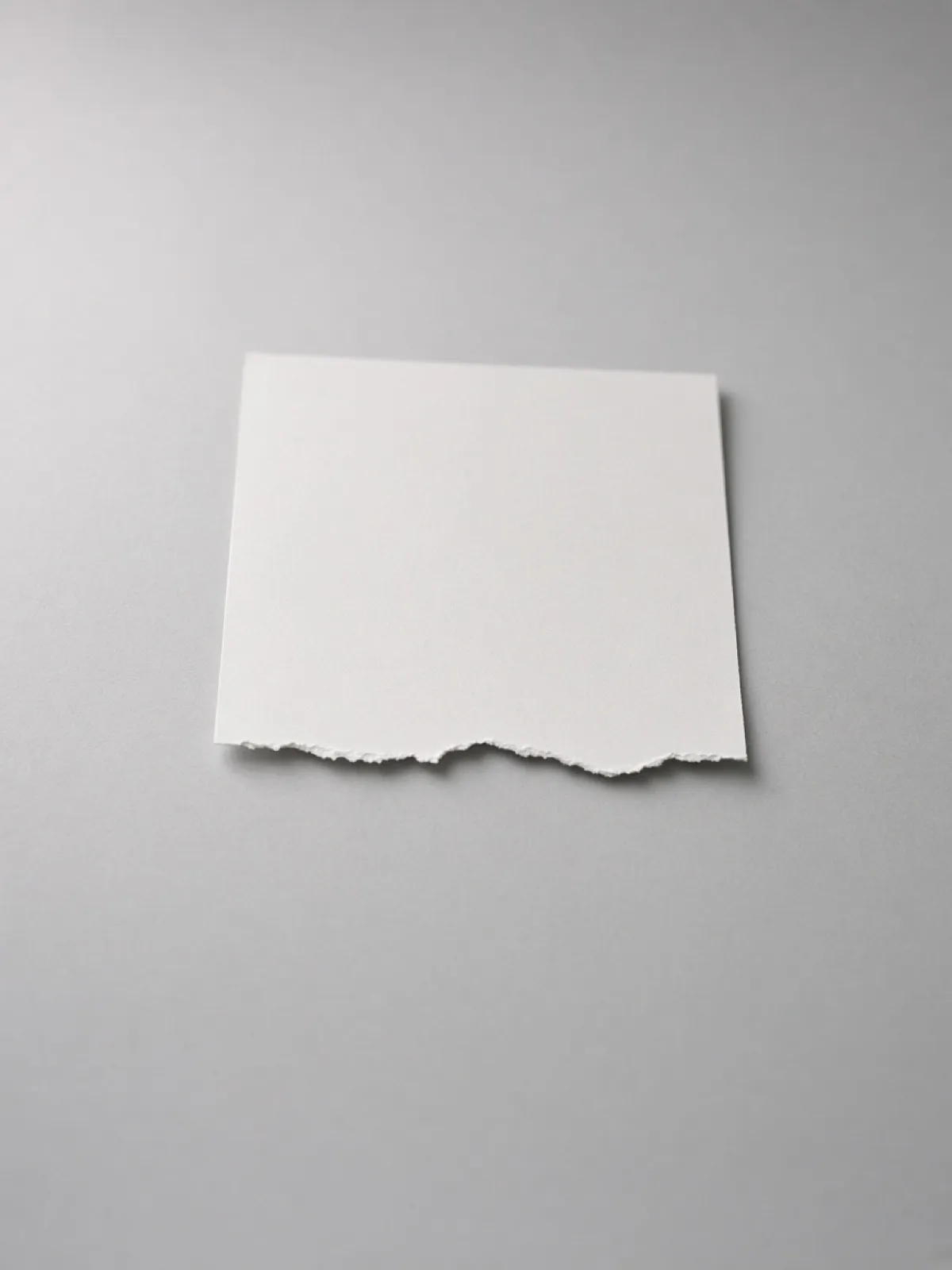 A torn page with the bottom half gone on a desk